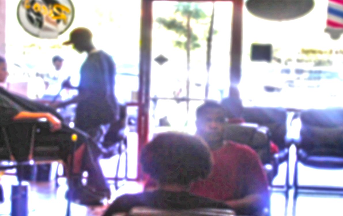 Inside Rico's Hair #2 with barbers working the floor